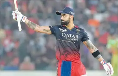  ?? Associated Press ?? ↑
Royal Challenger­s Bangalore’s Virat Kohli celebrates after scoring a half-century against Sunrisers Hyderabad during their IPL match in Hyderabad on Thursday.