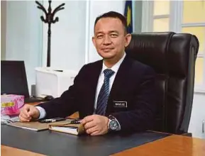  ?? BERNAMA PIC ?? Education Minister Dr Maszlee Malik on his first day in office in Putrajaya yesterday.