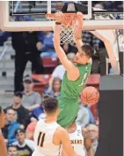  ?? ORLANDO RAMIREZ/USA TODAY SPORTS ?? Marshall forward Ajdin Penava dunks to score a basket against Wichita State in Friday’s first round of the 2018 NCAA Tournament at Viejas Arena.