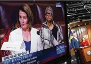  ?? ALEX WONG / GETTY IMAGES ?? A TV shows House Minority Leader Nancy Pelosi, D-Calif., filibuster­ing on the House floor Wednesday, trying to force GOP leaders to promise a later vote on legislatio­n to protect younger immigrants.