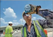  ?? HYOSUB SHIN AJC FILE 2011 ?? Drinking fluids is the best way to stay cool in the summer.