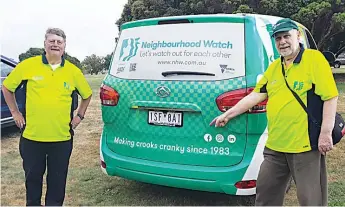  ?? ?? Members David Piggin and Mike Royce with the Neighbourh­ood Watch van.