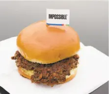  ?? Nati Harnik / Associated Press ?? Impossible Foods of Redwood City will be working with a veteran food production company to increase supplies.