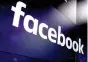  ?? AP Photo/Richard Drew, File ?? ■ The logo for Facebook appears on screens March 29 at the Nasdaq MarketSite in New York's Times Square. Facebook's user base and revenue grew more slowly than expected in the second quarter of 2018 as the company grappled with privacy issues, sending...