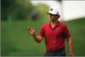  ?? SETH WENIG — THE ASSOCIATED PRESS ?? Matthew Wolff reacts after a shot on the 11th hole during the second round of the Travelers Championsh­ip on Friday in Cromwell, Conn.