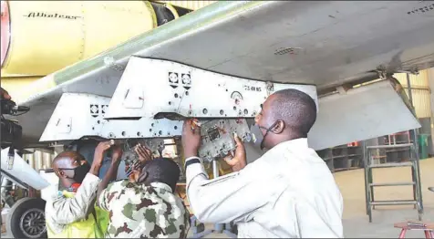  ?? PHOTO: NAN ?? Engineers reactivate L- 39ZA aircraft in the 403 Training School Nigerian Air Force in Kano as part of the Chief of Air Staff’s expansion of fleet for military operation… yesterday.
