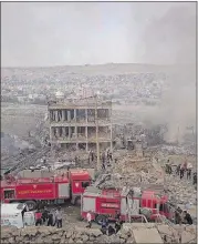  ?? DHA VIA AP ?? The three-story main police station was gutted Friday after Kurdish militants attacked a police checkpoint with an explosives-laden truck in Cizre in southeast Turkey.