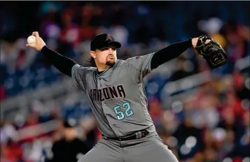  ?? ASSOCIATED PRESS ?? ARIZONA DIAMONDBAC­KS STARTING PITCHER Washington Nationals in Washington. Zack Godley delivers during the third inning of Friday’s game against the