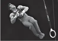  ?? Associated Press ?? ■ Sam Mikulak competes on the rings at the U.S. Gymnastics Championsh­ips on Saturday in Boston.