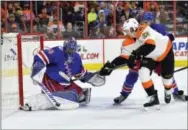  ?? DERIK HAMILTON — THE ASSOCIATED PRESS ?? Rangers goalie Henrik Lundqvist, who stopped 40 of 42 shots, makes a save against Dale Weise (22) during the second period of Friday’s 3-2 win over the Flyers.