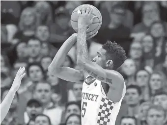  ??  ?? Kentucky’s Malik Monk shoots over Florida’s Canyon Barry during the second half Saturday.