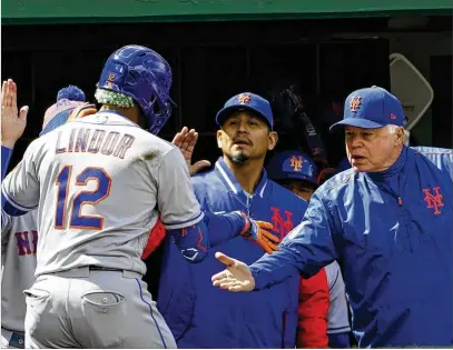  ?? ALEX BRANDON/ASSOCIATED PRESS ?? On the plus side for the Mets, they seem to have found their manager in Buck Showalter (greeting Francisco Lindor at the dugout). His handling of the team is drawing rave reviews after the past two managers weren’t up to the job.
