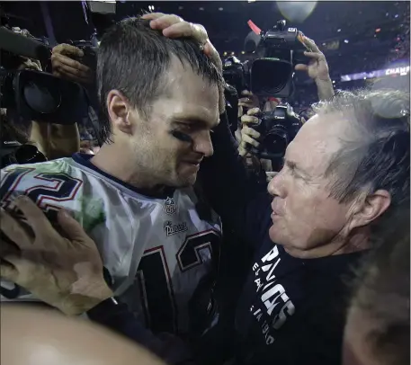  ?? MATT SLOCUM, FILE — THE ASSOCIATED PRESS ?? In this Feb. 1, 2015, file photo, New England Patriots quarterbac­k Tom Brady celebrates with head coach Bill Belichick after the team defeated the Seattle Seahawks to win the Super Bowl in Glendale, Ariz. The Patriots won 28-24.