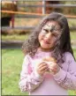  ?? JESI YOST - FOR MEDIANEWS GROUP ?? Stella Olaewe, 3, of Exeter, tries a powdered doughnut made in a Dutch oven by Exeter Boy Scout Troop 319.