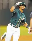  ?? Scott Strazzante / The Chronicle ?? Khris Davis celebrates after his 42nd home run gave the A’s a lead in the sixth inning.