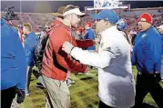  ?? THE OKLAHOMAN] [PHOTO BY BRYAN TERRY, ?? OU coach Lincoln Riley and Kansas coach David Beaty shake hands after their Nov. 17 game.