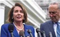  ?? Alex Brandon/Associated Press ?? ■ House Speaker Nancy Pelosi of Calif., left, and Senate Minority Leader Chuck Schumer of N.Y., speak with reporters Wednesday after a meeting with President Donald Trump at the White House.