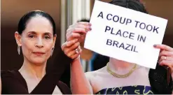  ??  ?? This file photo shows Brazilian actress Sonia Braga (left) with French producer Emilie Lesclaux (right) holding a protest sign for the screening of the film ‘Aquarius’ at the 69th Cannes Film Festival in Cannes, southern France. — AFP