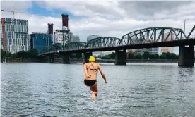  ??  ?? Flexing survival muscles … Bonnie Tsui, jumping into the Willamette River in Portland, Oregon. Photograph: Frances Duncan