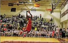  ??  ?? The “T/E FLITE Crew” played against the world famous performanc­e team, the Harlem Wizards, for a fun night of trick hoops and alleyoops on March 31 at Conestoga High School in Berwyn,