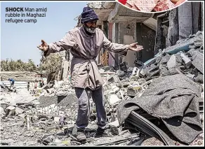  ?? ?? SHOCK Man amid rubble in Maghazi refugee camp