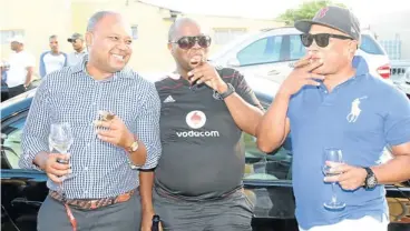  ??  ?? CIGAR STAR: Tony Yengeni, right, parties with friends at the Corner Lounge in Gugulethu