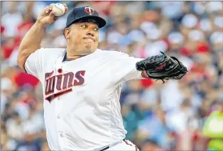  ?? AP PHOTO ?? In this July 18 file photo, Minnesota Twins starting pitcher Bartolo Colon throws to the New York Yankees in the first inning of a game in Minneapoli­s.