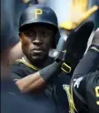  ??  ?? Starling Marte receives congratula­tions from teammates after scoring in the ninth inning Thursday.