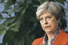  ?? Alastair Grant/Associated Press ?? Britain’s Prime Minister Theresa May listens Friday during a proceeding in Maidenhead, England.