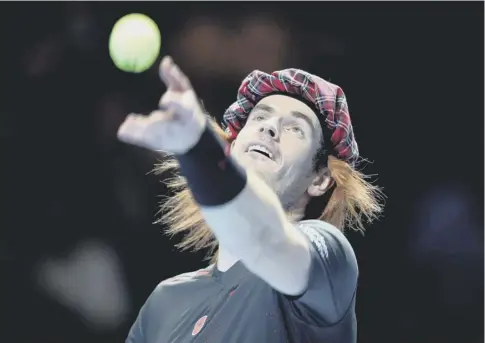  ??  ?? 0 Andy Murray dons a tartan bunnet as he takes on Roger Federer in an exhibition match in Glasgow. Federer won in a match tiebreak.