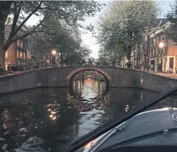  ?? BRANDIE WEIKLE PHOTOS FOR THE TORONTO STAR ?? A boat tour passes one of Amsterdam’s many canal bridges.