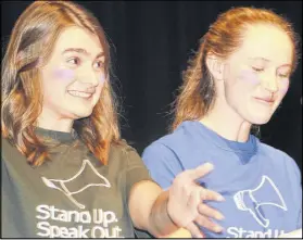  ?? LYNN CURWIN/TRURO DAILY NEWS ?? Bailey Chisholm, left, and Tara Cashen, co-presidents of the CEC student council, introduced guests during the ‘Stand Up, Speak Out’ gathering at the school.