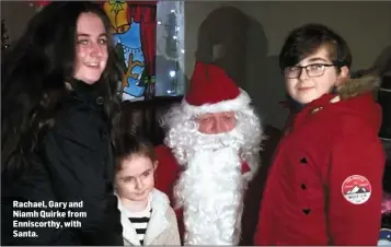  ??  ?? Rachael, Gary and Niamh Quirke from Enniscorth­y, with Santa.