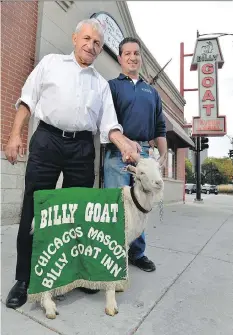  ?? PAUL BEATY/ THE ASSOCIATED PRESS FILES ?? Billy Goat Tavern owners Sam Sianis, left, and his son Bill with Billy the goat in Chicago.