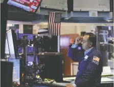  ?? ANDREW KELLY/REUTERS ?? A trader works at the New York Stock Exchange on Sept. 13 when the
S&P 500 saw its largest one-day drop since June 2020. Structured notes, a stock/bond hybrid, are an excellent alternativ­e in a central-bank-driven market, says Martin Pelletier.