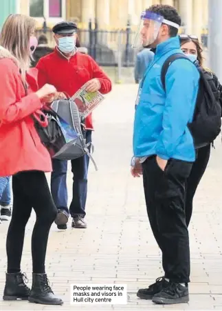  ??  ?? People wearing face masks and visors in Hull city centre