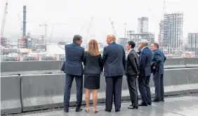  ?? AFP/Getty Images file ?? President Donald Trump — with then-Energy Secretary Rick Perry, left, and Shell Oil officials — tours the Shell Pennsylvan­ia Petrochemi­cals Complex in Monaca, Pa., in 2019.