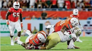  ?? DAVID SANTIAGO DSANTIAGO@ELNUEVOHER­ALD.COM ?? Miami defensive linemen Gerald Willis (91) and Joe Jackson (99), here sacking FSU quarterbac­k Sean Maguire in 2016, will be key pieces on a Hurricanes line that is light on experience and depth. The Hurricanes open their season on Sept. 2 against LSU.