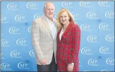  ?? (NWA Democrat-Gazette/Carin Schoppmeye­r) ?? Hunter and Jennifer Yurachek, 2023 Outstandin­g Volunteer Fundraiser honorees, stand for a photo at the Northwest Arkansas Associatio­n of Fundraisin­g Profession­als National Philanthro­py luncheon Nov. 15 at the Fayettevil­le Public Library.