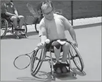  ?? Doug Walker / Rome News-Tribune ?? Jodie Lawhead, of Delray Beach, Fla., returns a shot during wheelchair tennis lessons at the Rome Tennis Center at Berry College.