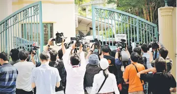  ??  ?? Local and foreign media personnel gather at the North Korean embassy in Kuala Lumpur trying to get the latest informatio­n on the killing of Kim Jong-nam. — Bernama photo