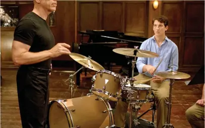  ?? Pictures: GETTY ?? ALL THAT JAZZ: Miles Teller with JK Simmons as the tyrannical teacher in Oscar-winning film Whiplash