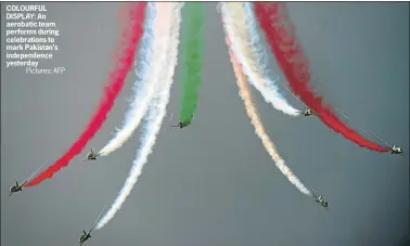  ?? Pictures: AFP ?? COLOURFUL DISPLAY: An aerobatic team performs during celebratio­ns to mark Pakistan’s independen­ce yesterday