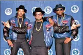  ??  ?? The rap group Run-DMC, from left, Joseph “Run” Simmons, Darryl “DMC” McDaniels, and Jason Mizell “Jam Master Jay,” poses March 2, 1988, at the 31st annual Grammy Awards in New York.