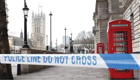  ??  ?? A police security cordon remains around the Houses of Parliament in London. — AFP photo