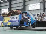  ?? FANG ZHE / XINHUA ?? Waste for recycling is weighed at a service center in Shanghai’s Minhang district last month.