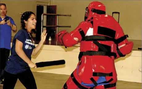  ?? WILLIAM ROLLER PHOTO ?? Arley Bueno, Brawley Union High School senior fights off Cory Van Driessche, Central Union High School Law Academy coordinato­r at IVROP’s second annual Law Enforcemen­t Skills Competitio­n at Lions Center Gym in Brawley on Thursday.