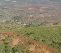  ?? Maui Police Department photo ?? A single-engine wheel-equipped Textron Aviation aircraft crashed about 3 miles southwest of Molokai Airport on Dec. 10, 2017, killing two people aboard. Visible at the top of the photo is Runway 5, which the plane was headed for in turbulent weather conditions.