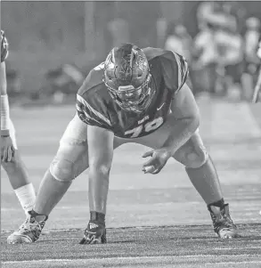  ?? CHRISTIE HEIDELBERG/SPECIAL to The Saline Courier ?? Bauxite senior offensive lineman Gavin Roe gets set to block in a game this past season. Roe earned 7-4A All-state honors recently.