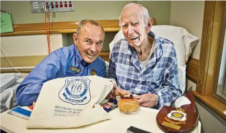  ?? Photo: Nev Madsen ?? VETERAN CARE: Visiting returned servicemen at St Vincent’s Private Hospital yesterday is Toowoomba United RSL sub-branch welfare officer Trevor Fuelling (left) with 96-year-old World War Two veteran Keith Dwyer.